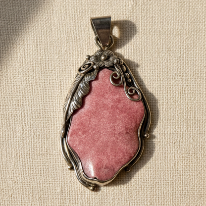 Rhodonite Pendant on Elegant Background