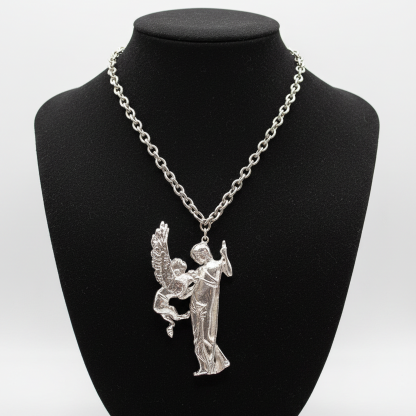Silver Necklace on Black Fabric Mannequin