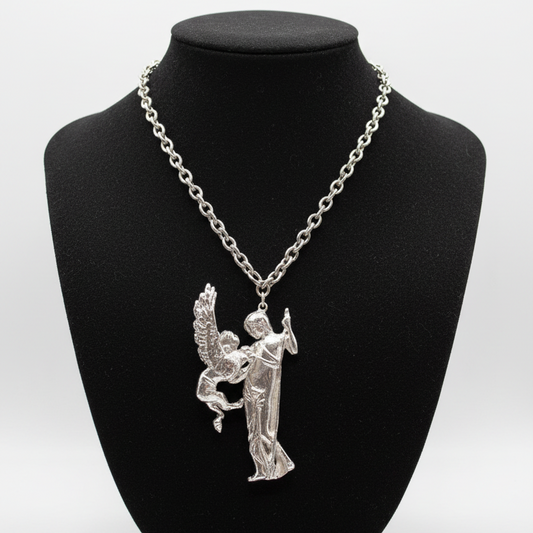 Silver Necklace on Black Fabric Mannequin