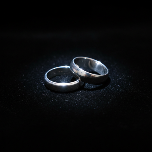 White gold wedding bands on velvet background